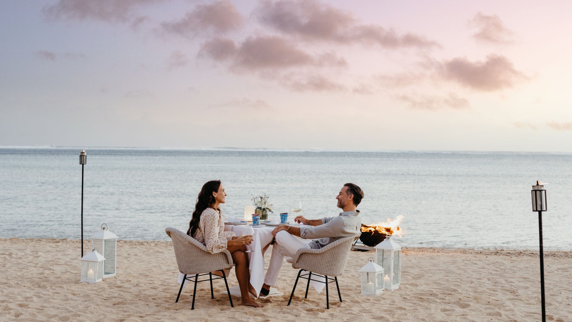 Couple enjoying a beachfront dinner in Mauritius
