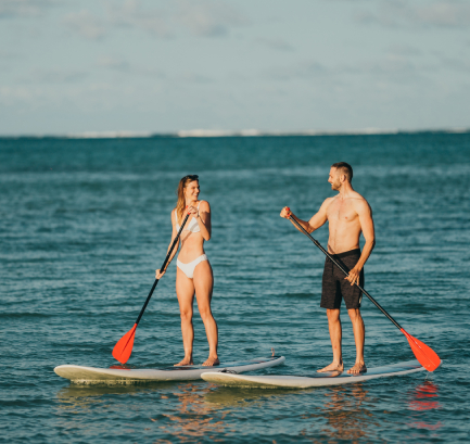 Stand up paddle in Mauritius lagoon with turquoise water