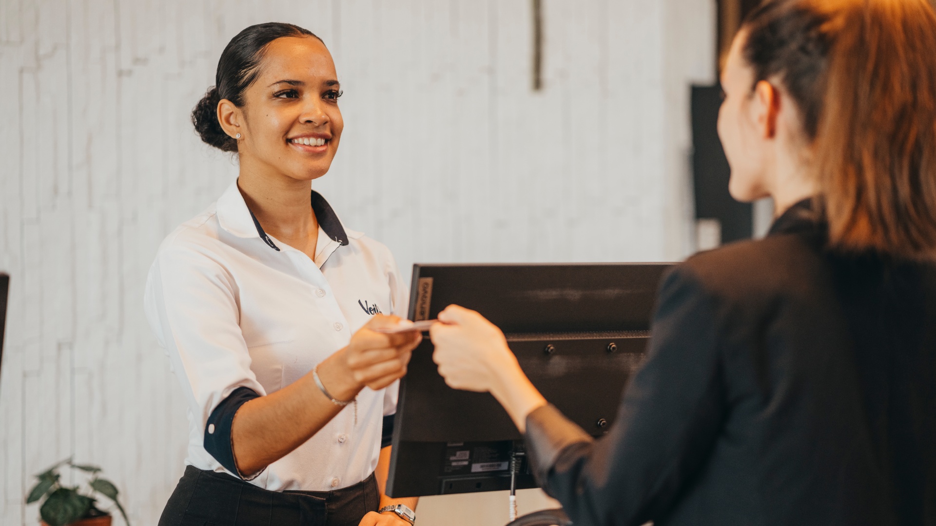 Fast check-in service at Voilà Hotel reception