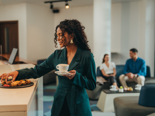 Business professionals enjoying a meal service while working