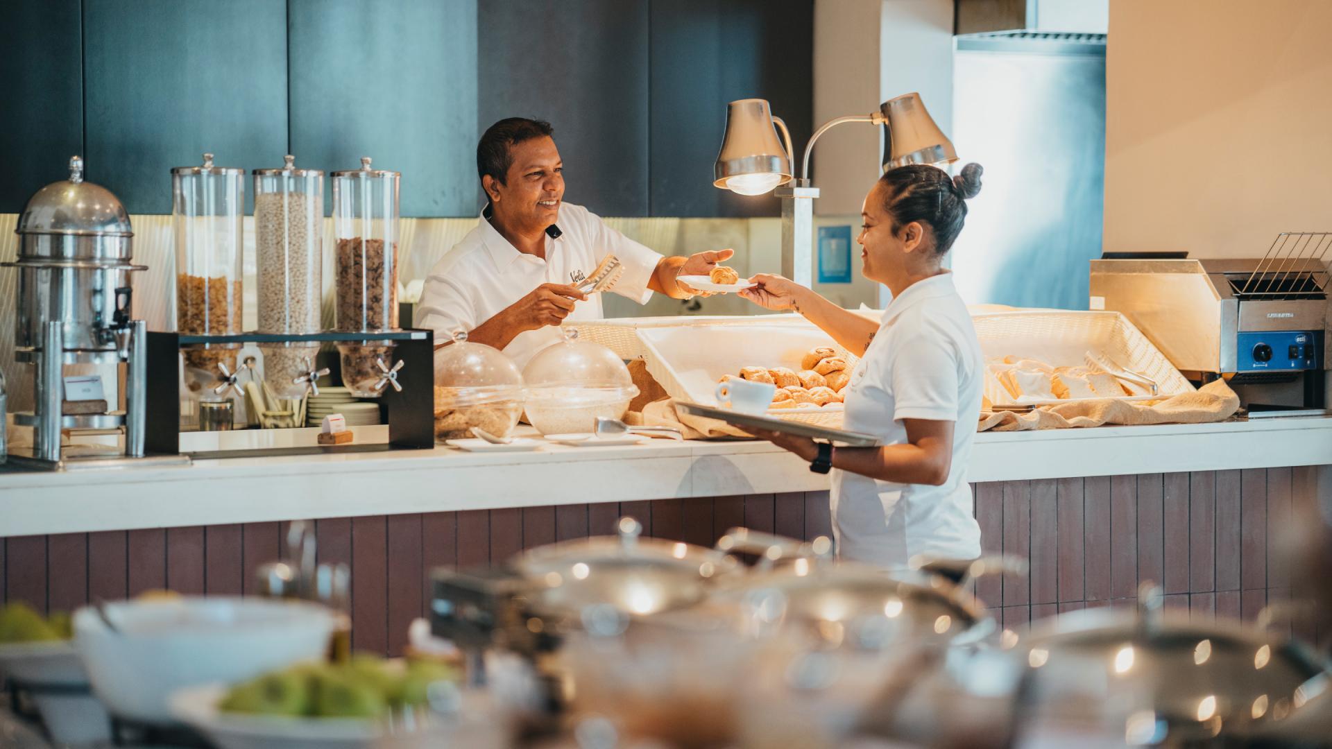 Business professionals enjoying lunch during a meeting at Voilà Hotel in Mauritius