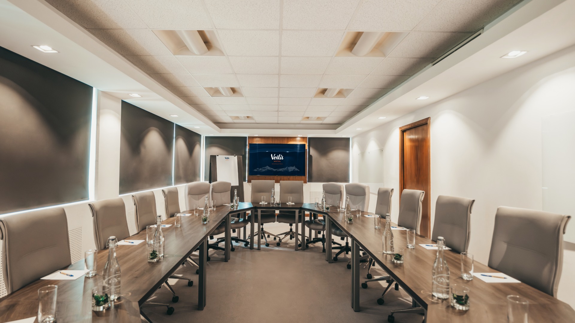 Meeting room at Voilà Hotel set up for a professional business event